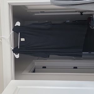 Black top with opening on shoulder